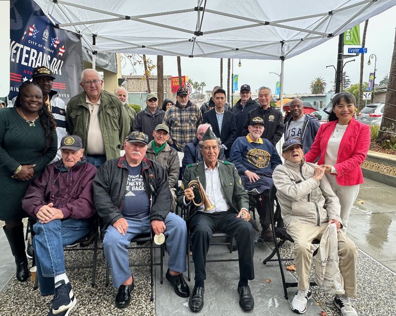 Bob Nguyen among neighbors and veterans under the City of Millbrae Veterans Day tent